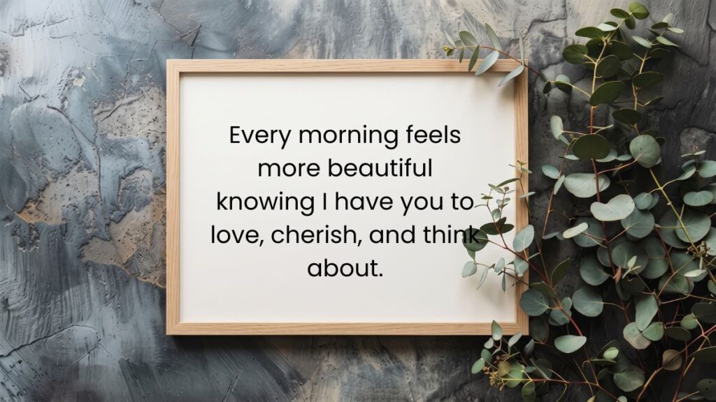 Wooden picture frame next to eucalyptus leaves displaying the best morning quotes for him.