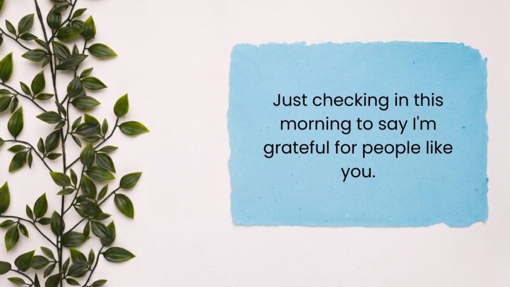 Blue paper card next to green climbing vines with good morning have a great day.