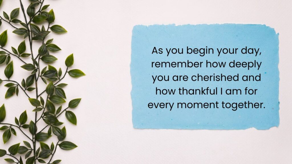 Blue paper card next to green vines displaying a heartfelt good morning message for my wife on textured wall.