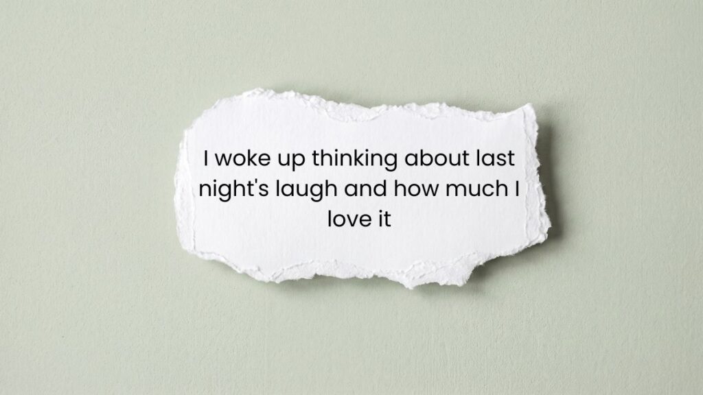 Torn paper note on green background displaying heart touching good morning messages for love.