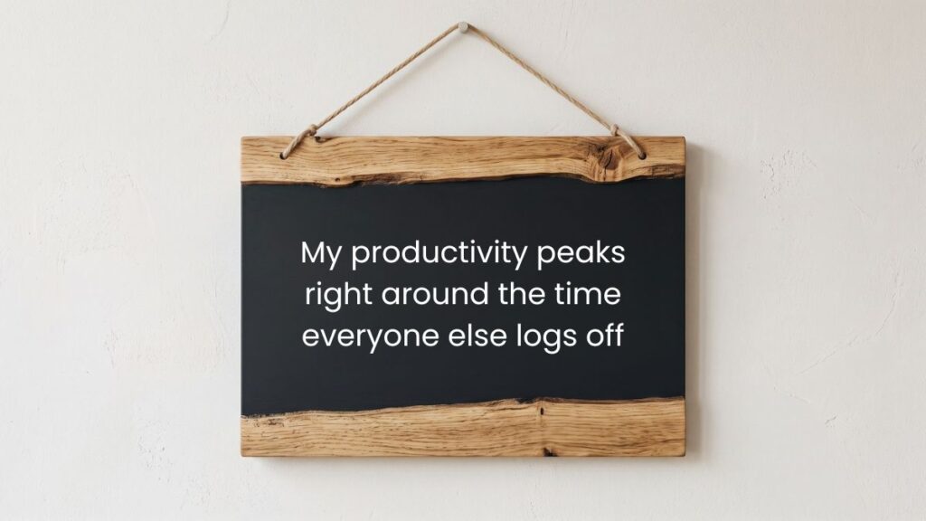 Wooden chalkboard sign hanging on wall displaying tuesday motivational quotes for work.